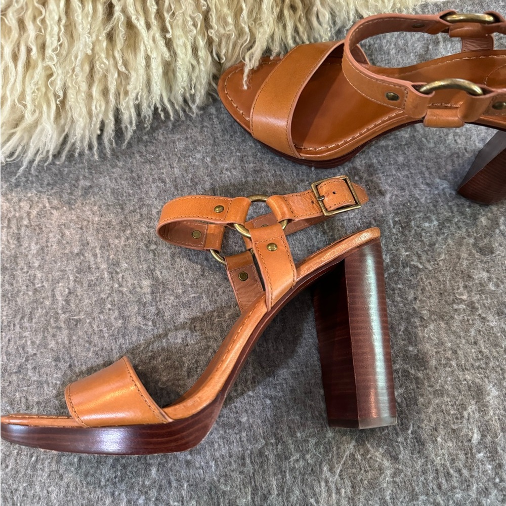 Beautiful tan leather with brass hardware. 5 inch heel with 3/4 inch platform.